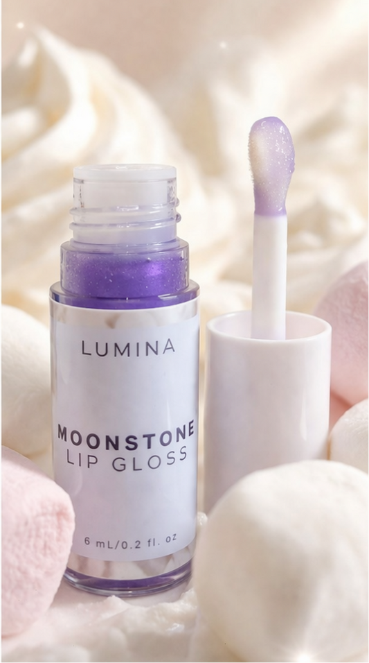 Lumina Moonstone lip gloss with applicator on a soft background