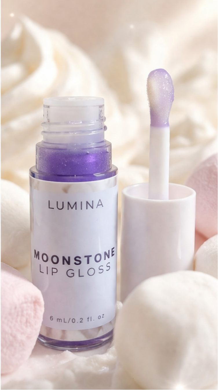 Lumina Moonstone lip gloss with applicator on a soft background